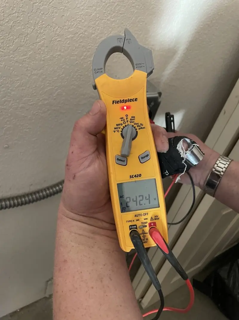 Voltage testing with clamp meter during Outlet Installation in Thomasville